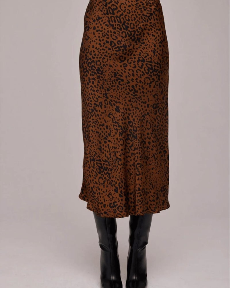 Front of a model wearing a size Large Bias Midi Skirt in Gold Dots Print in Gold Dots Print by Bella Dahl. | dia_product_style_image_id:346402